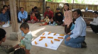 image of a doctor discusssing behavioural changes needed to manage dengue outbreaks.