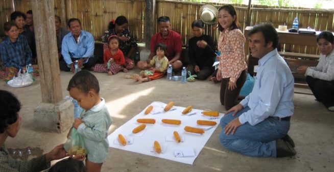 image of a doctor discusssing behavioural changes needed to manage dengue outbreaks.