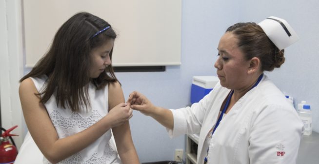 Image of a young woman getting a vaccine to discover the true value of vaccination