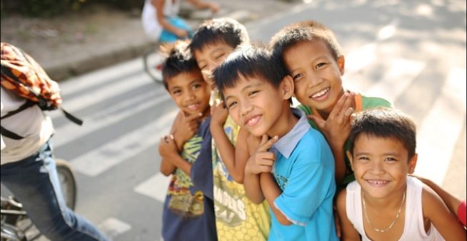 Image, small group of children. Dengue vaccine effectiveness depends on community engagement