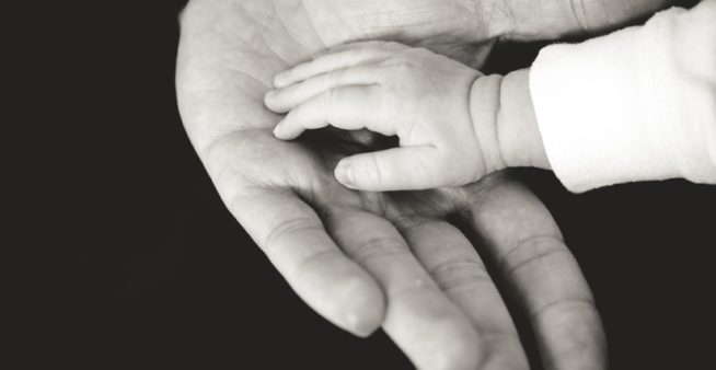 Image of hand reaching out, representing the community health projects funding offer from Break Dengue.