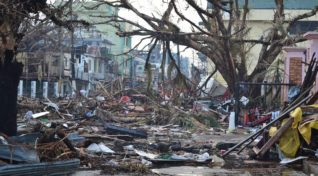 Image shows the natural disaster, Typhoon Haiyan which added to dengue cases in Philippines.