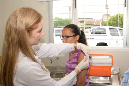 Image of a woman getting vaccinated against dengue in Parana, Brazil. 