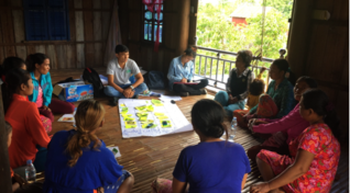 Image: a meeting on fighting dengue in Cambodia using guppies.