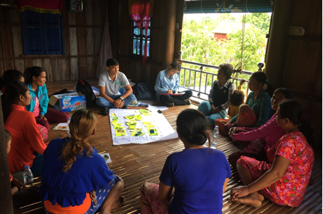 Image: a meeting on fighting dengue in Cambodia using guppies.